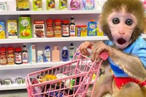 Monkey Baby Bon Bon doing shopping for toys in the supermarket and eats ice cream with puppy