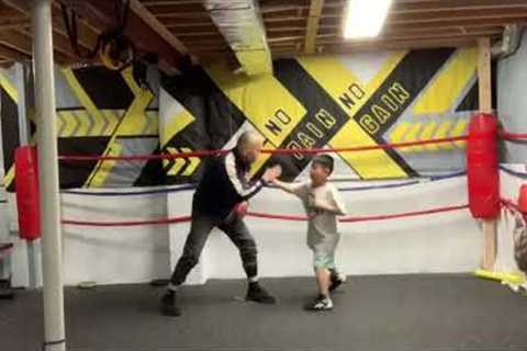 Bryan and Ethan training boxing with Coach Cat